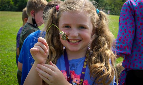 Girl has butterfly on hand